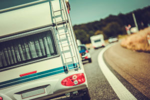 Recreational Vehicle Riding On Busy Highway