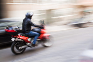 riding motorcycle in motion blur