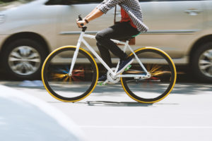 Man riding on bicycle on the road, blurred motion
