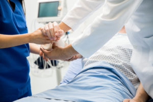 Putting bandage on a patient