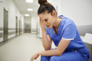 Female nurse suffering
