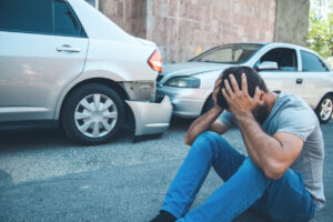 car accident sad man with car accident