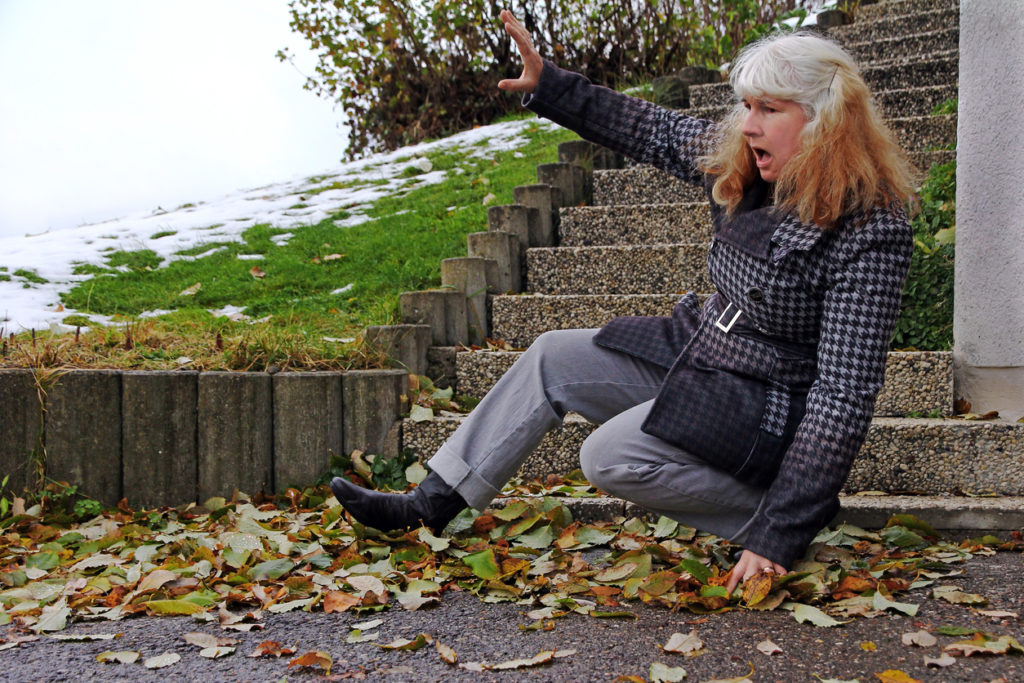 A woman slipped on wet leaves and fell. Wet leaves are dangerous