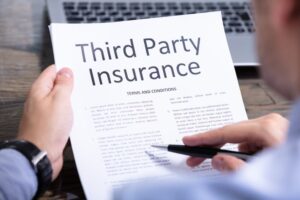 Man reviewing third-party insurance terms and conditions carefully.