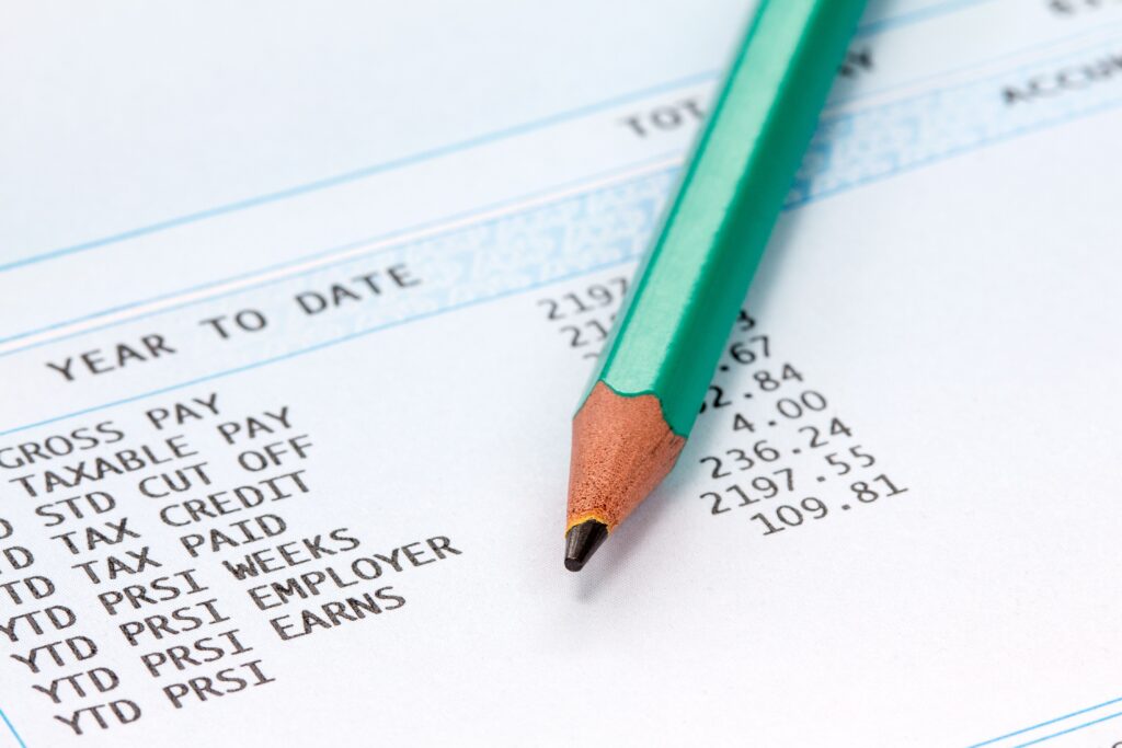 1099 tax form and pay records on a desk