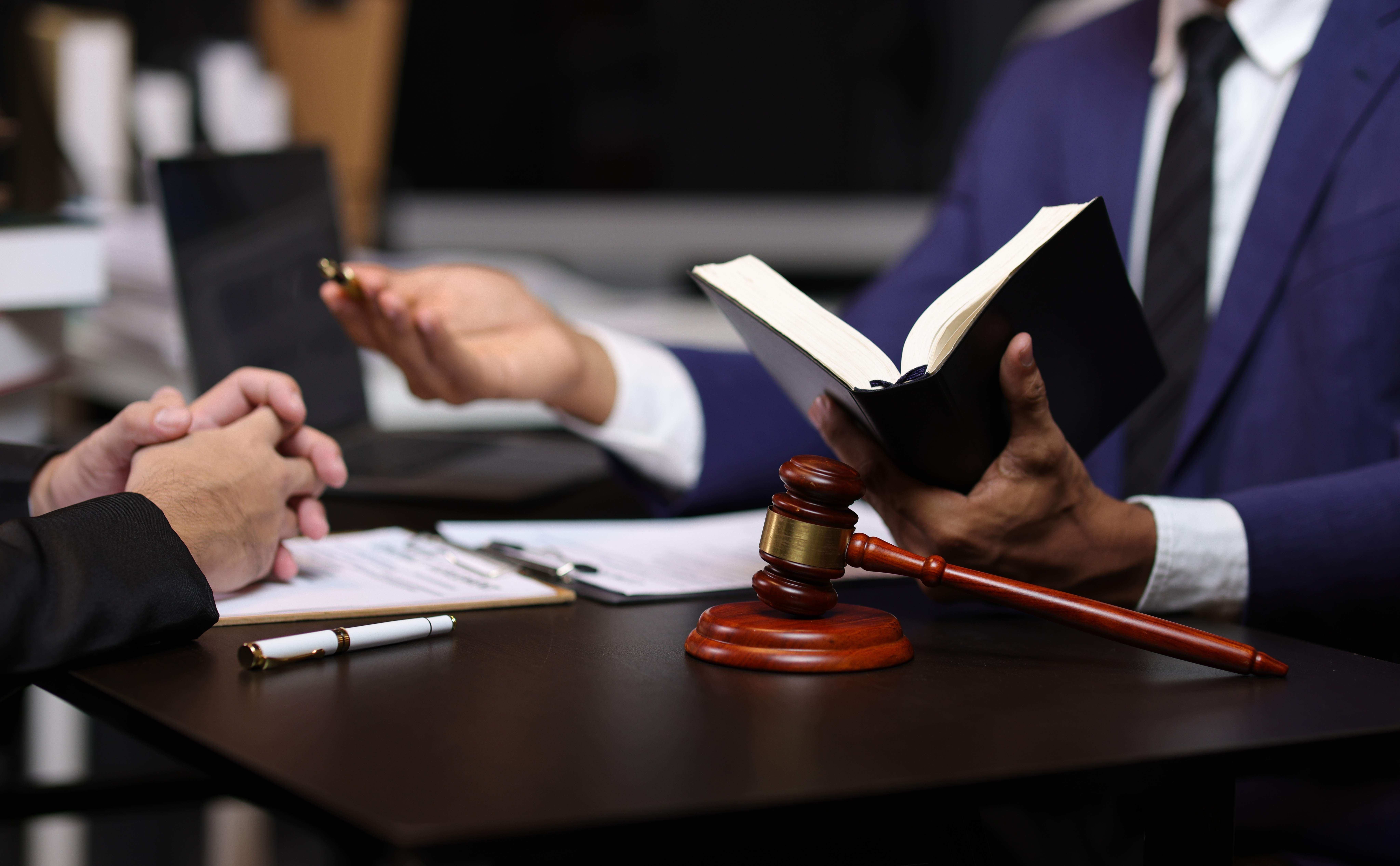 Legal file folders stacked on a desk